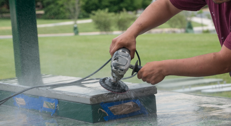 Worker using a saw outside